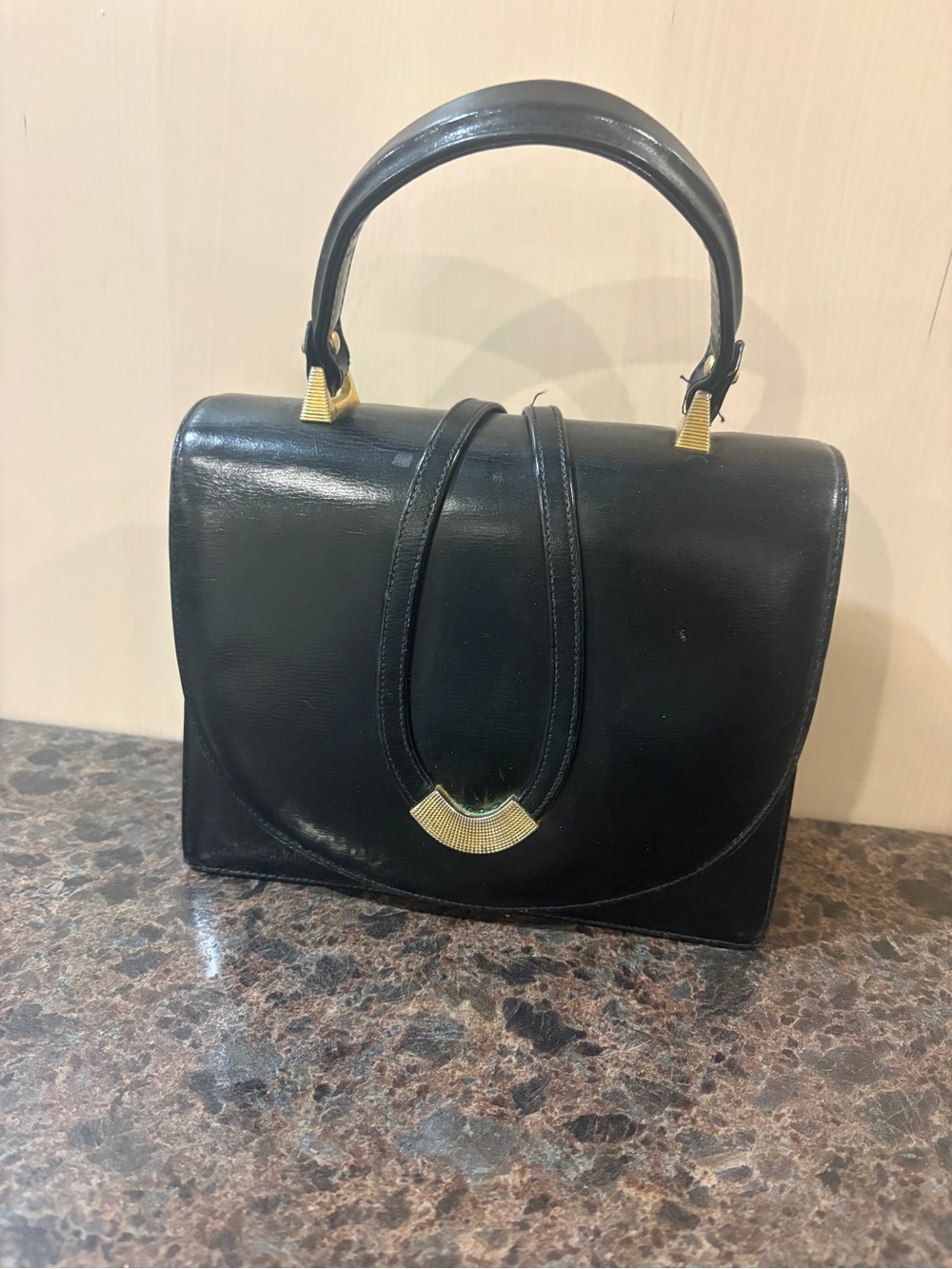 Classic Black Leather Top-Handle Bag with Gold Accent